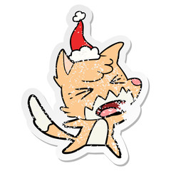 angry distressed sticker cartoon of a fox wearing santa hat