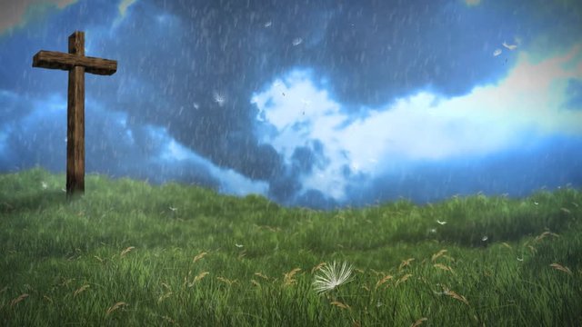 Cross on a Hill Approaching Storm 4K Loop features an old wooden cross in a grassy field with wind-blown rain, clouds, and dandelion seeds in the atmosphere