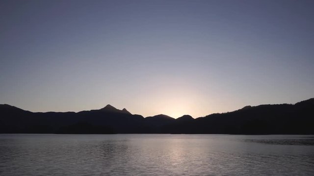 Sunset over Long Arm inlet, mountains, Queen Charlotte, Haida Gwaii