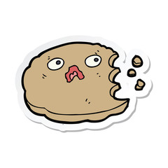 sticker of a cartoon bitten cookie