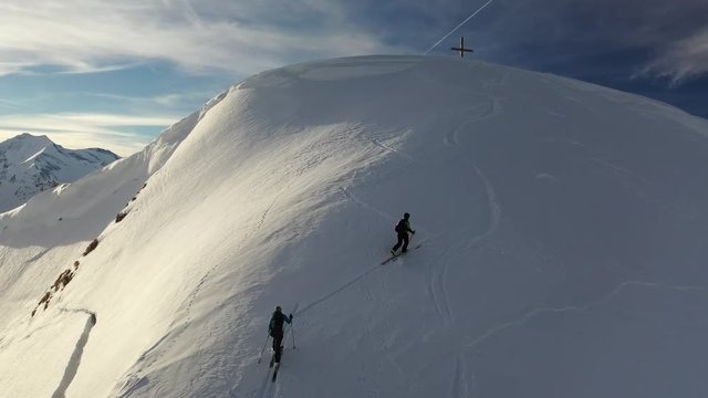 Two ski mountaineers on their last steps before the summit called Rei&szlig;rachkopf in Rauris, Salzburger Land, Austria