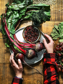 Woman holding plate with beetroot