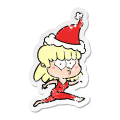 distressed sticker cartoon of a woman running wearing santa hat