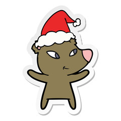 cute sticker cartoon of a bear wearing santa hat