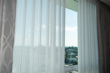 Fototapeta na wymiar white curtain interior decoration on window