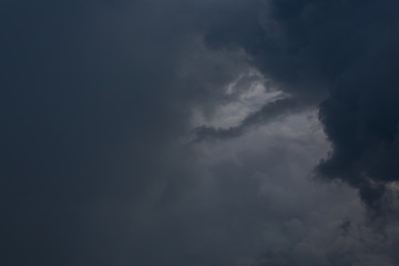 Naklejka na ściany i meble heavy storm cloud on dramatic moody dark sky