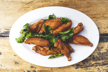 Deep fried chicken wing tips with Kaffir lime leave.