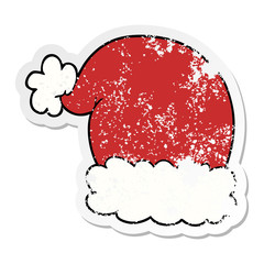 distressed sticker of a cartoon christmas hat