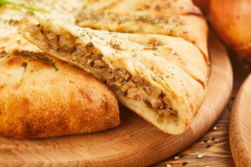 Pie with salmon fish and onion