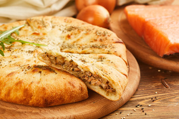 Pie with salmon fish and onion