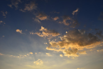 Orange color fluffy  cloud at sunset , White cotton candy clouds on tropical blue sky at night, Thailand