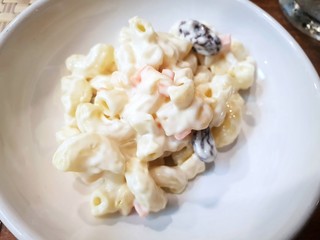 Top view of Macaroni salad on white plate, Side dishes in Korea restaurant, Selective focus