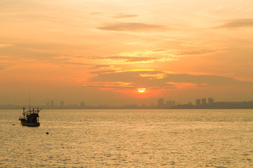 Naklejka na ściany i meble abstract sunrise in the sea view of sea ship near the town at asia