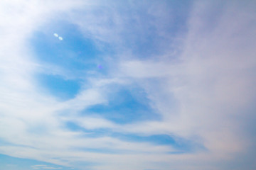 blue sky background with tiny clouds