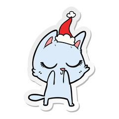 calm sticker cartoon of a cat wearing santa hat