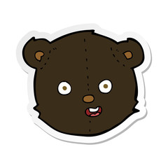 sticker of a cartoon black teddy bear head