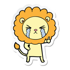 sticker of a cartoon crying lion