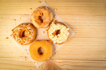 Donuts on wooden background