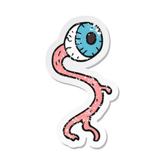 retro distressed sticker of a gross cartoon eyeball