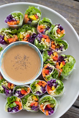 Healthy raw salad rolls and peanut dip