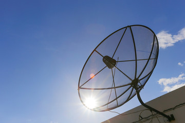 Satellite dish to the sky in blue sky background with tiny clouds