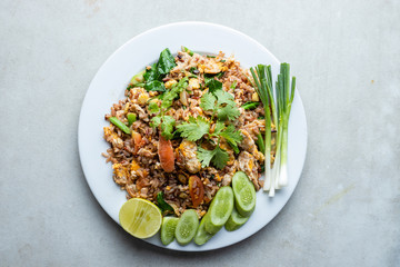 Chicken fried rice in white plate.