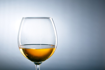 wine glass on gray background with copy space. alcohol concept.