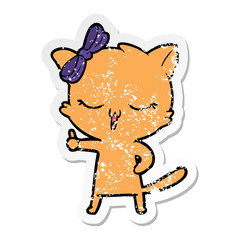 distressed sticker of a cartoon cat with bow on head