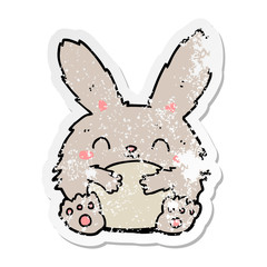 distressed sticker of a cute cartoon rabbit