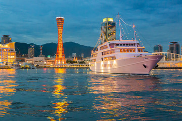 Cityscape view of Skyline and Port of Kobe with modern yacht.