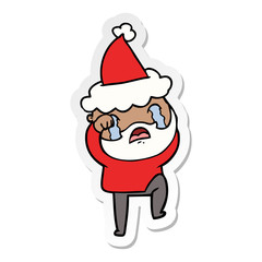 sticker cartoon of a bearded man crying and stamping foot wearing santa hat