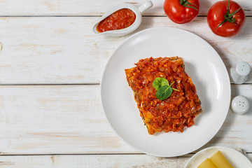Cannelloni with ground beef baked in tomato sauce. The view from the top. Copy-space.   
