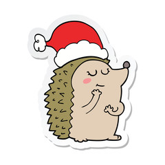sticker of a cartoon hedgehog wearing christmas hat