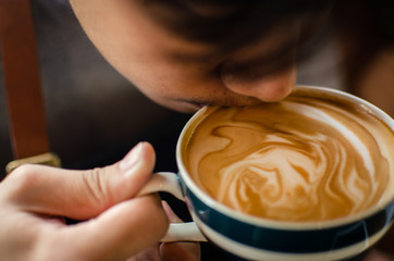 close up of man drinking coffee