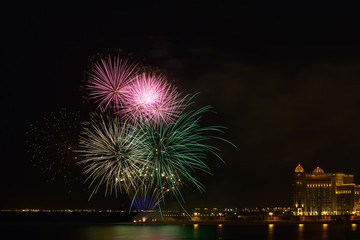 Fireworks illuminating the sky with different colors