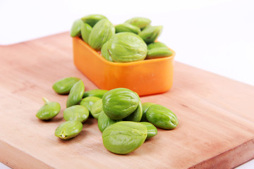 Parkia speciosa seeds or bitter bean on white background