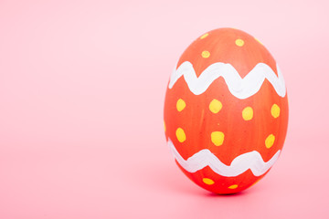 Beautiful Easter Red egg color on pink background, Easter day concept