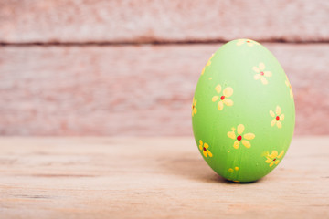 Beautiful Easter Green egg on wooden