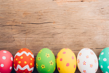 Beautiful Easter multi color egg on wooden