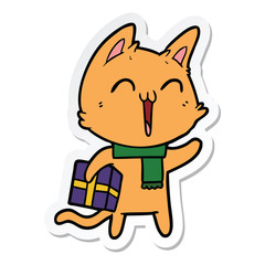 sticker of a happy cartoon cat with christmas gift