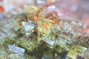 Obraz na płótnie Canvas Crystals of fluorite with hematite inclusions from Illo calcite quarry in Finland