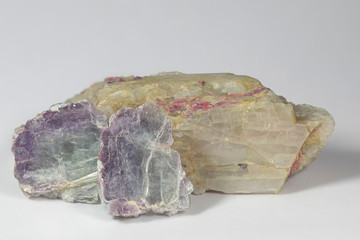 Major industrial lithium minerals.  Shiny lithium mica lepidolite and crystal of spodumene with...