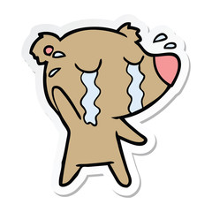 sticker of a cartoon crying bear