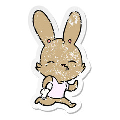 distressed sticker of a cartoon running rabbit
