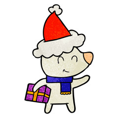 female polar bear with christmas present wearing santa hat