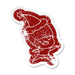cartoon distressed sticker of a stressed man wearing santa hat