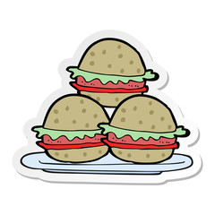 sticker of a cartoon plate of burgers