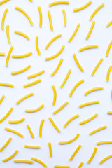 Different types of dry pasta on white.