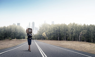 Business woman with an old TV instead of head.