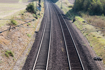 Fototapeta na wymiar The length of the railway track. Industrial concept background. Transportation travel tourism.